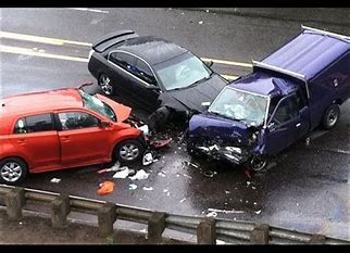 A group of cars all in a vehicle accident.