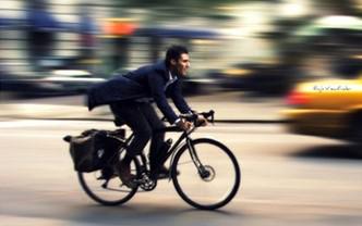 Man on a bicycle commuting to work.