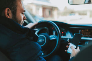 Man texting and driving